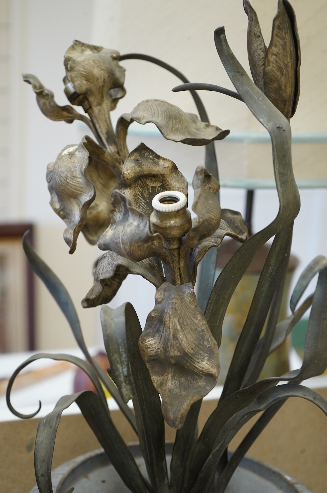 A pair of cold painted bronze floral lamps with painted cast iron campagna urns, 76cm high